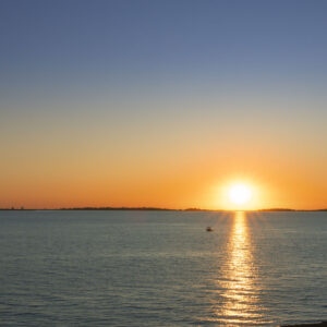 A setting sun over Folsom Lake, California